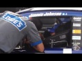 Crew members work on 48 car of NASCAR points leader Jimmie Johnson at Michigan International Speedwa