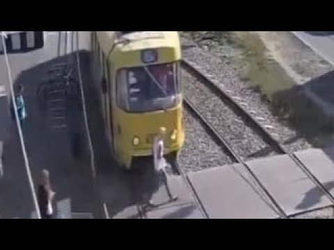 Warning, graphic video: Woman hit by train, loses leg
