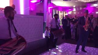 Sax & dhol drums playing Indian wedding entrance.