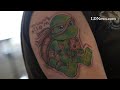 Matt Stoner of Fredericksburg checks out his latest tattoo of the ninja turtle Michelangelo which wa