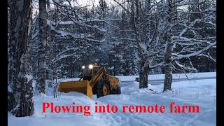 Snow plowing into a remote farm in Arctic Lapland