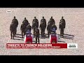 Tribute to French soldiers: coffins are taken away as band sings