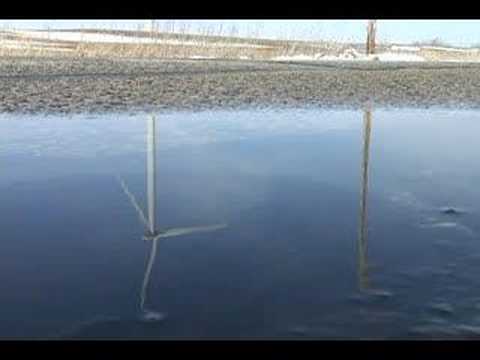 You have to listen close, but you can just hear the giant wind turbines cutting through the air at one of the wind farms in Fond du Lac county WI.