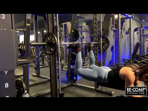 Smith machine reverse hyperextension