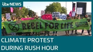 Extinction Rebellion protesters hold up rush hour traffic | ITV News