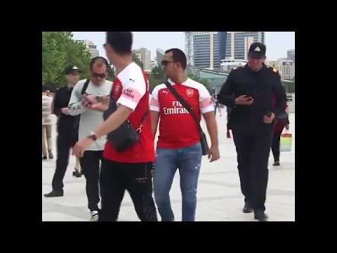 Arsenal fans wearing Henrikh Mkhitaryan shirts stopped by police in Baku