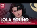 Lola Young Is 'Back' And Feeling 'Better' Months After Collapsing On Stage | Fast Facts