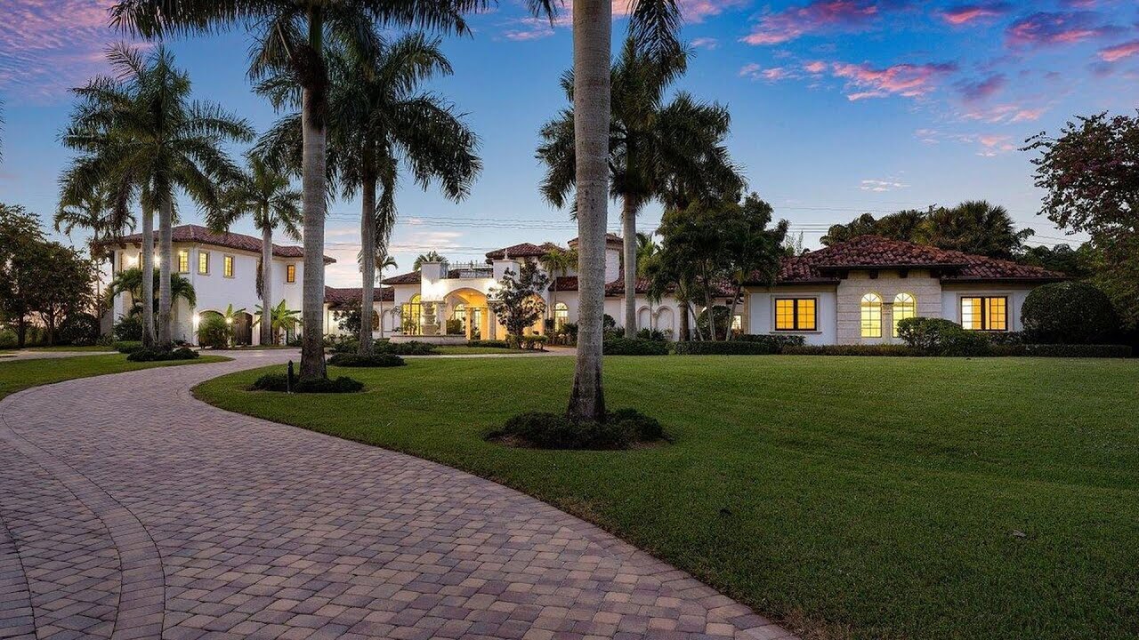 ⁣$4,485,000! Truly epic property in Delray Beach has an expansive backyard with cascade waterfall
