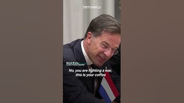 Ukrainian and Dutch leaders joke over a cup of coffee at NATO summit
