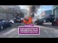 Audi bursts into flames in Birmingham as forklift driver moves hurriedly to save cars
