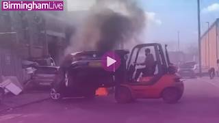 Audi Bursts Into Flames In Birmingham As Forklift Driver Moves Hurriedly To Save Cars
