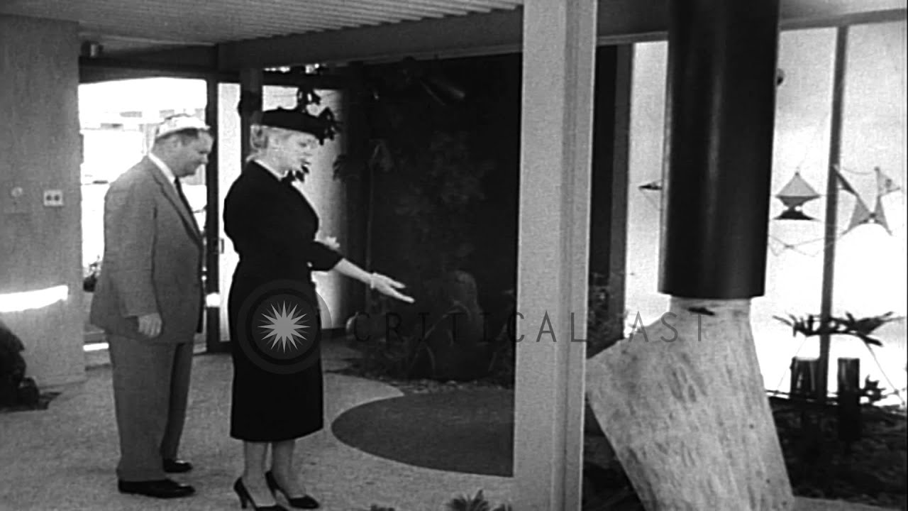 Couple visits an Eichler X-100 experimental house with modernistic features displ...HD Stock Footage