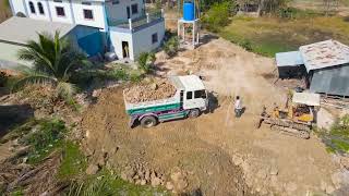 Unusually !! It is impressive that the KOMATSU fill the hole in the back of the house with Dozer