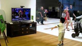 Kid playing kidnet Dance Central Disturbia on Hard