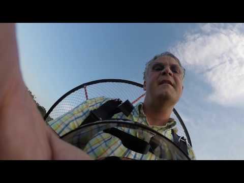 Sorry for the audio and not editing this. One of my shoulder straps was flapping behind me causing the slapping noise.I took off from Osborne Middle school. They have a small field in the front of the school with just enough room to launch when the wind is in the right direction. John Low flew his PPC with me too. I think he barely made it out.Once in the air we circled a couple times, then headed west to the Hamilton Mill upper pool with the slide. My family was there enjoying a swim, so I want to do a buzz-by and blow my little party horn I keep in the right harness pocket.Once over the pool, John laid out some smoke and I blew the horn. Everyone from the pool was jumping, waving, and yelling up to us. You might be able to see Candice waving from the steps in the upper right, and Corey and his friend Nick, jumping and waving from the lower right.We then headed out over the golf course and straight to my house. Once to my house, Ashley was outside in the driveway waving and yelling. I blew the party horn again and proceeded to fly around the neighborhood a couple times. Didn't see any neighbors out, but I think a couple heard me to come out and look. John in the mean time was out over the lake blowing smoke.We then headed back east to Little Mulberry park to buzz the lake and the dam. Lots of people out waking the park that day. We flew the dam, then decided to go over to the other side of the park. To do that, we needed to gain some altitude to clear the trees over to the other side. So I started circling up in full power.Unfortunately, I forgot to return my motor's high end before the flight. And being that it was 95 degrees out, My motor was running too rich. When I almost reached altitude, my motor lost full power, and I was only able to maintain 5,500 rpm, which only keeps me in level flight. You can see in the video where I look at my throttle a couple time squeezing it fully closed.At that point I decided to head back to the school and land. I was still about 10 minutes out from t Flight from Osborne Middle school around Dacula, GA
