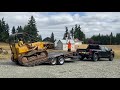 Loading a John Deere 450-C bulldozer onto a Trail Max tilt deck trailer. Goodbye free 450-C dozer!