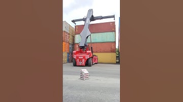 Kalmar Reach stacker with a tilting spreader for container handling