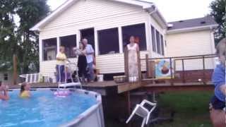 Bride jumps into pool after wedding ceremony