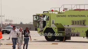Plane evacuation slides deployed with firetrucks