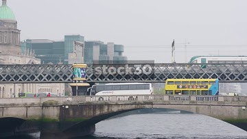 Traffic And Train Crossing Bridges Over River Liffey In Dublin, Ireland