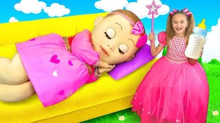 Sasha plays with a Big Baby doll