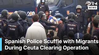 Spanish Police Scuffle With Migrants During Ceuta Camp Clearing at Trampolín Beach | AM1N