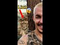 Lion sneaks up on human