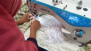 t-shirt hanger loop attach.  140 pcs capacity per hour