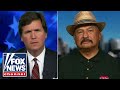 Tucker takes on a migrant caravan supporter