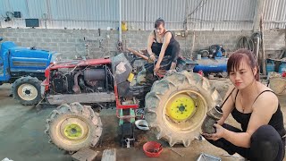 The genius girl repairs and restores the tractor.