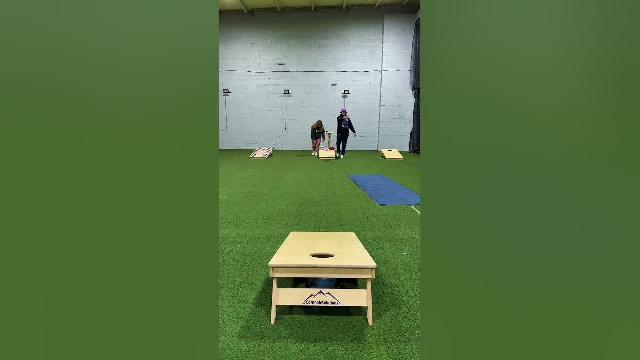 Professionals practicing cornhole YouTube