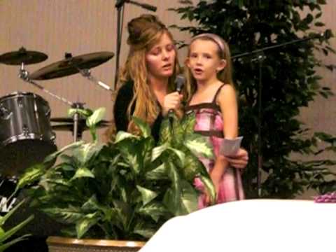 megan and kelby singing at tracy's funeral