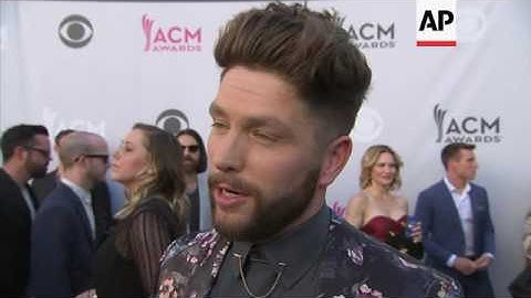 Cam walks the ACM carpet without a shirt, Chris Lane gets tied up by Britney Spears