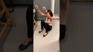 Girl accidentally hits herself on face with exercise band
