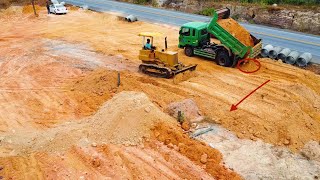 Beautiful 5Ton trucks unloading dirt into slope and D31P Dozer pushing for landfill 50*100 meters...