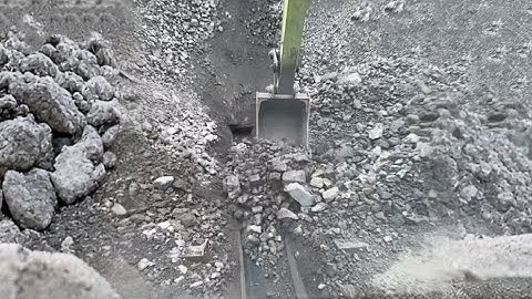 Barge unloading 4900 tons of crushed phosphate rock - Part 2 long video - Excavator working on barge