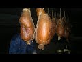 Smoking hams in a Finnish smoke sauna