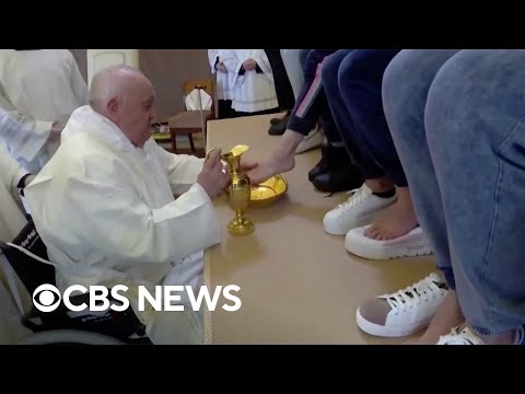 Pope Francis washes feet of 12 women at Rome prison in ceremony.