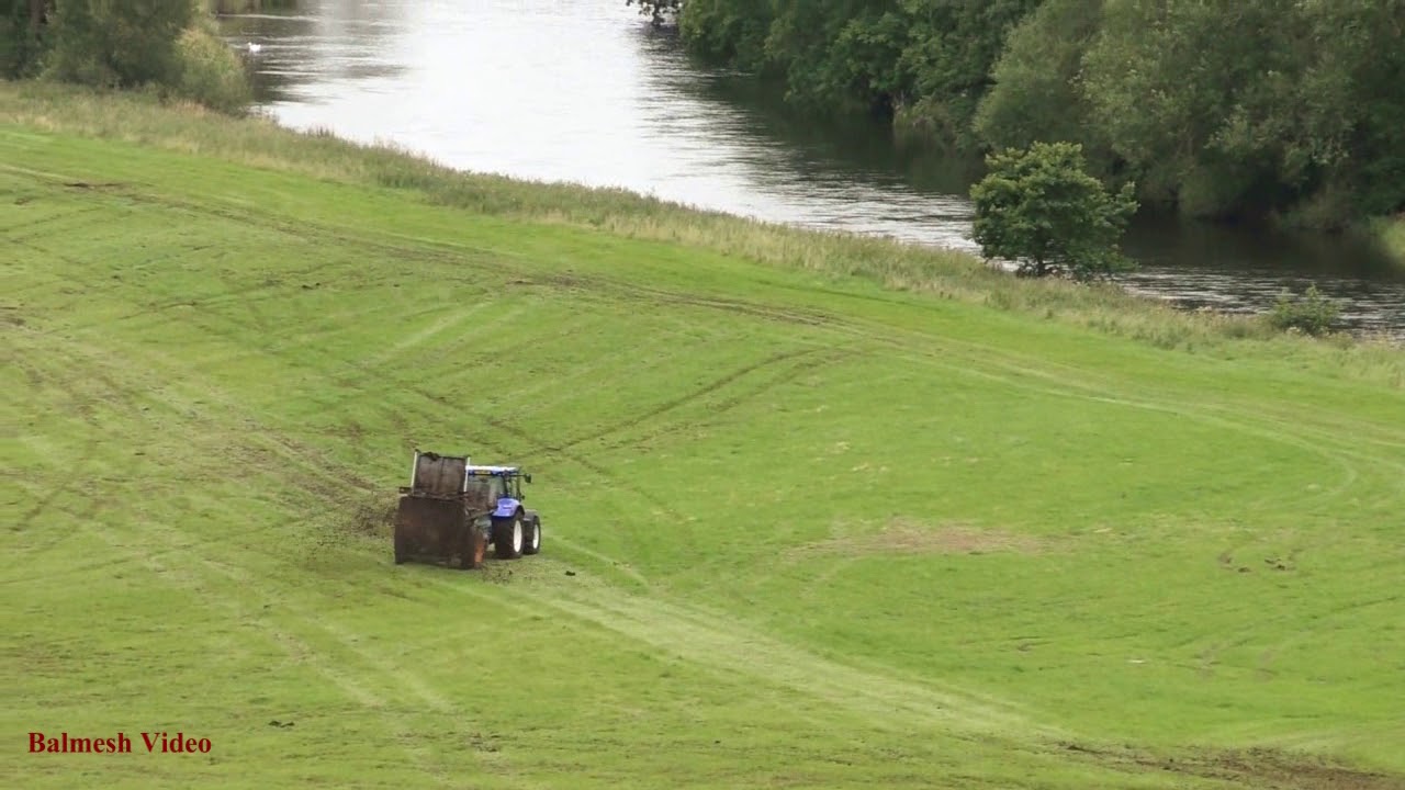 Muck-Spreading beside the Eamont.  New Holland action.