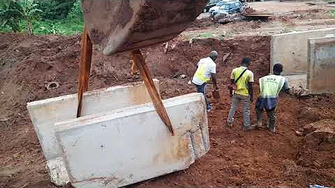 Installation of drainage precast element with excavator machine