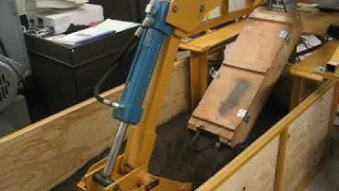 Bilateral passive teleoperation of a hydraulic backhoe with power scaling