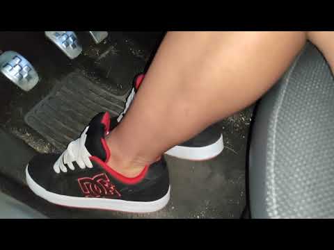 Kate is driving in DC skate shoes