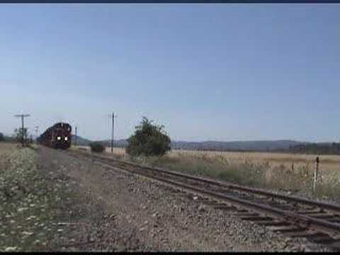 CORP "mini log" train heads past the since replaced semaphores outside of Eugene, OR.