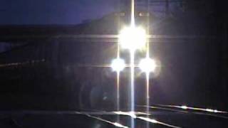 BNSF 4333 leads a long grain train West with NS Power