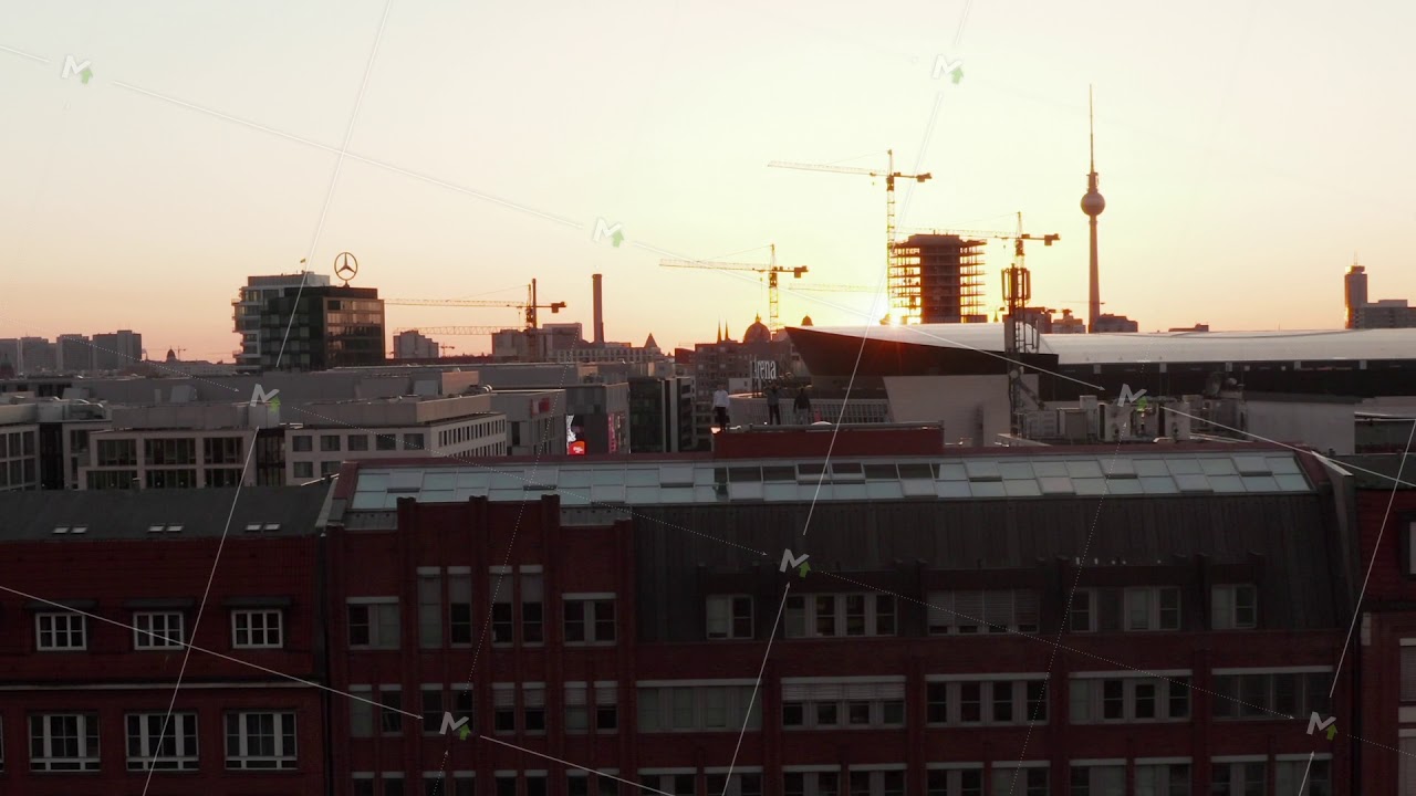 AERIAL: Flight over Berlin, Germany at beautiful Sunset, Sunlight and view on Alexanderplatz TV