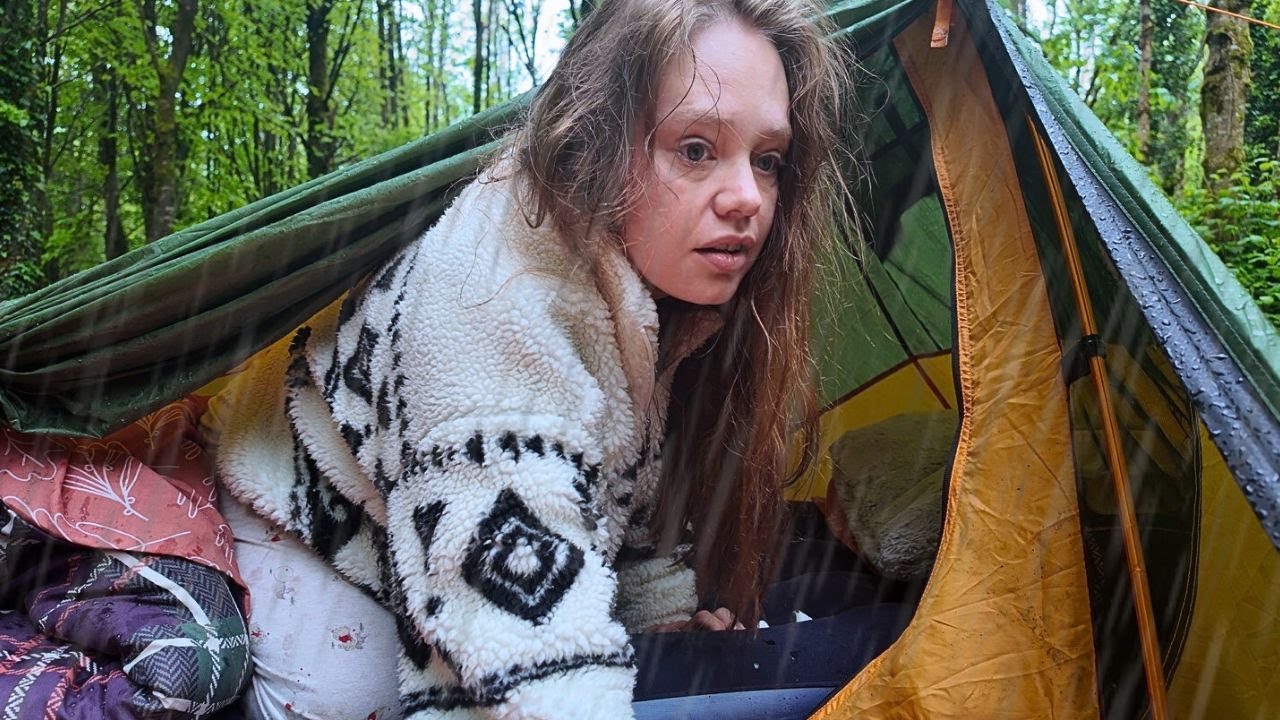 Wild camp alone in a creepy forest with heavy rain