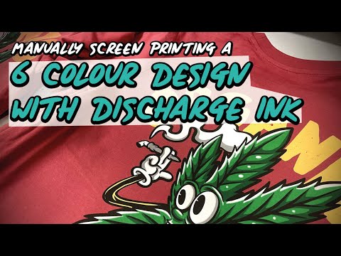 Manually screen printing a 6 colour image with discharge ink.