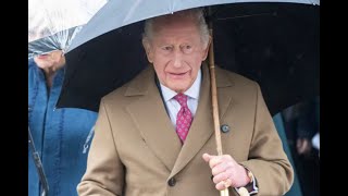 King Heckled on walkabout in the rain