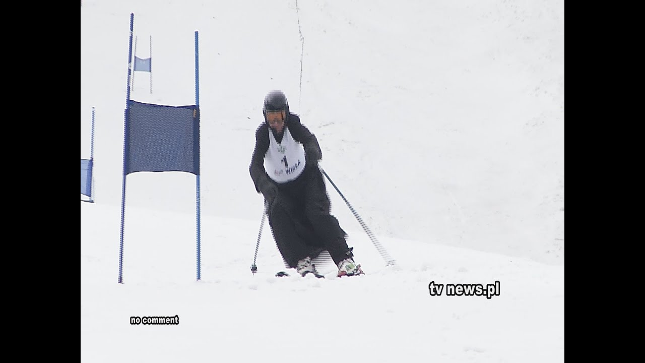 Polish priests in cassocks and ski boots take part in an annual skiing ...
