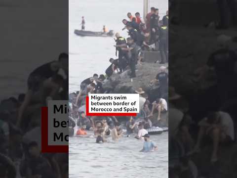 Migrants swim between border of Morocco and Spain - BBC Africa